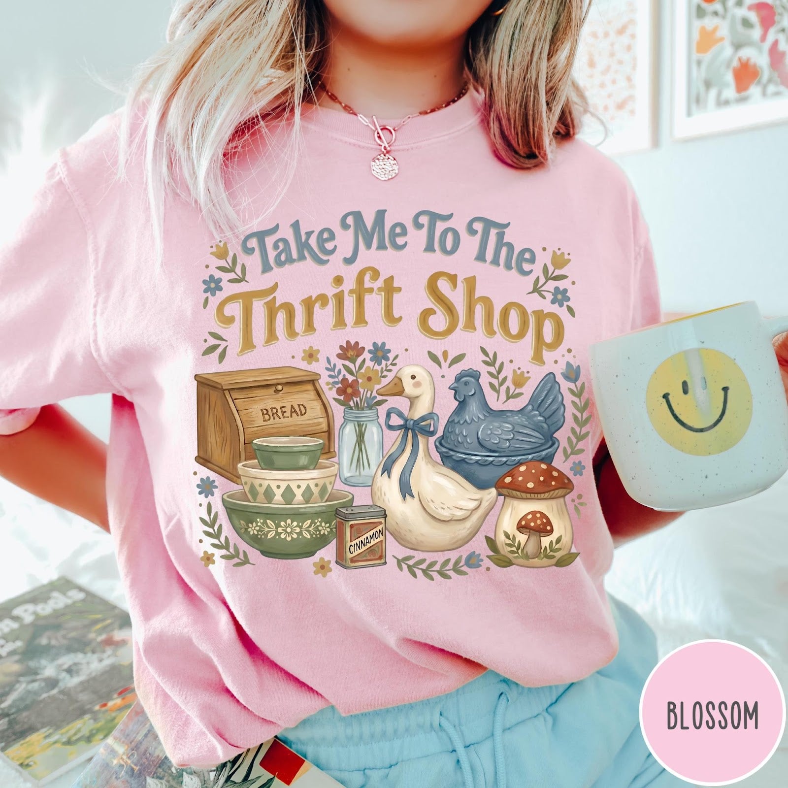 Comfort Colors tee in Blossom featuring vintage kitchenware graphic with bread box, bowls, goose, and mushroom.