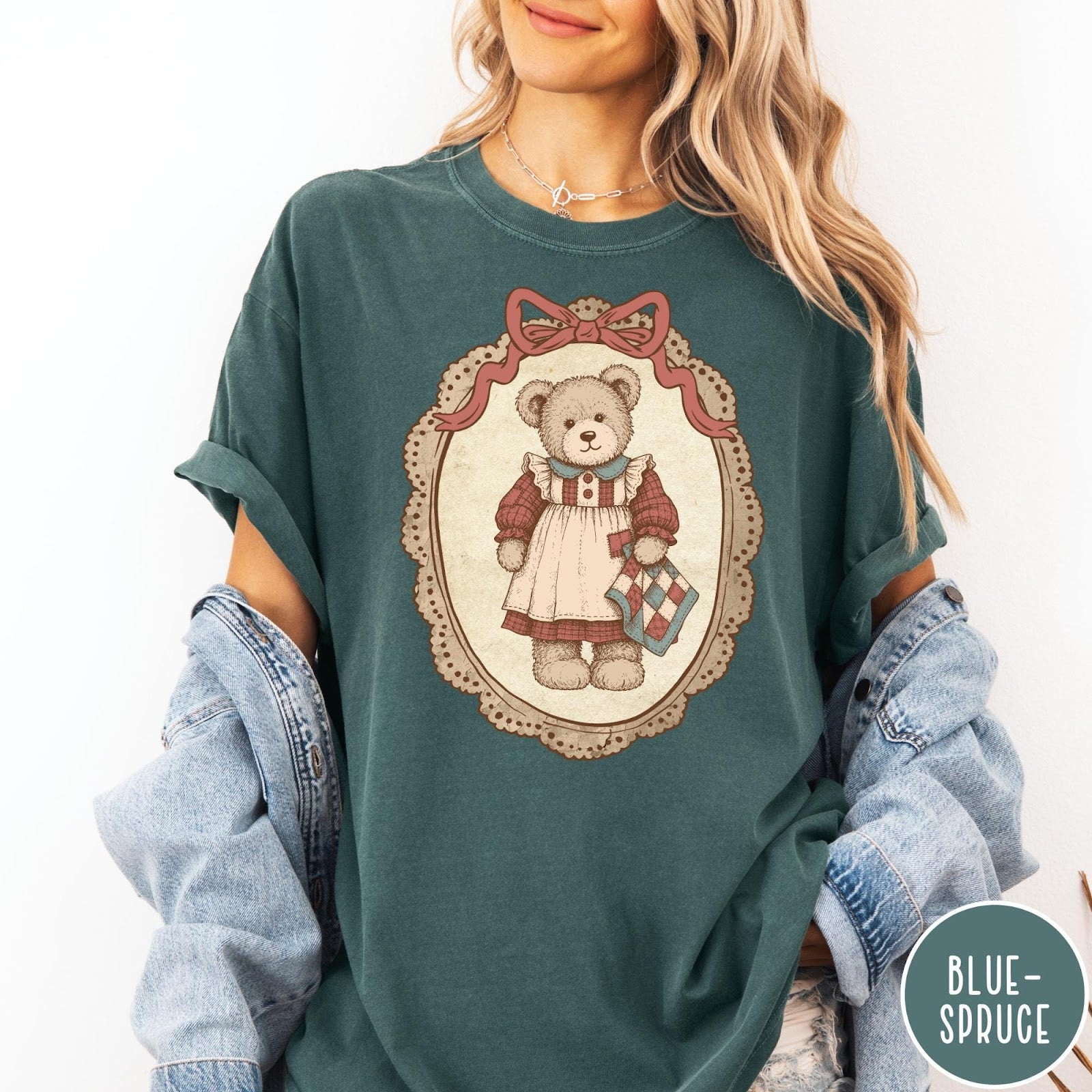 Comfort Colors tee in Blue Spruce featuring vintage style teddy bear graphic inside a decorative lace oval frame