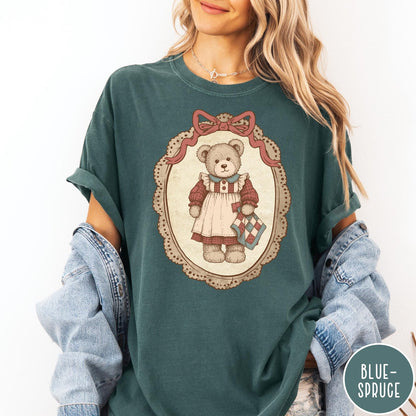 Comfort Colors tee in Blue Spruce featuring vintage style teddy bear graphic inside a decorative lace oval frame