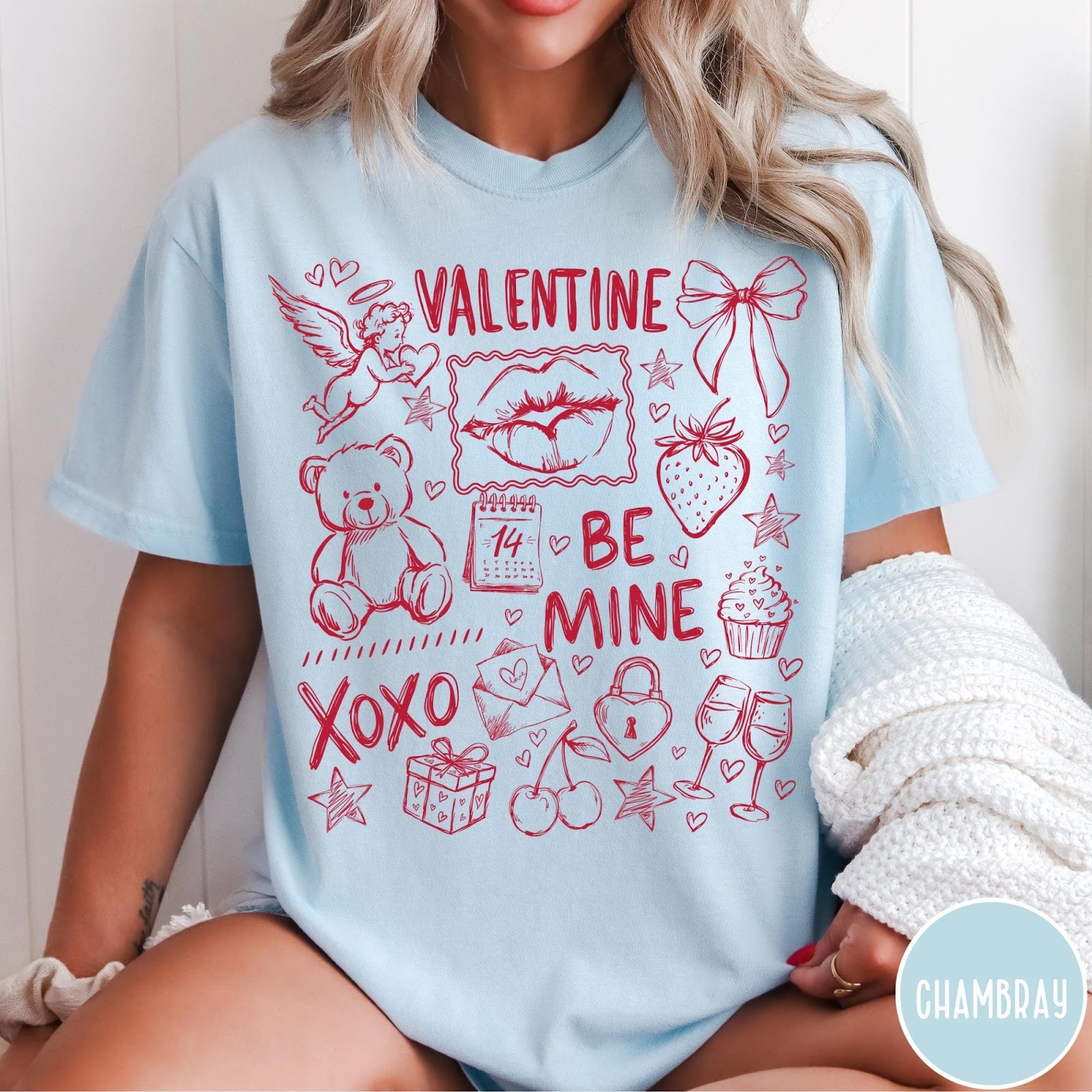 Comfort Colors tee in Chambray featuring sketch style Valentine's Day collage graphic with cupid, bear, and hearts