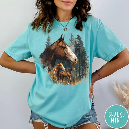 Comfort Colors tee in Chalky Mint featuring vintage style graphic of three horses standing in a pine forest