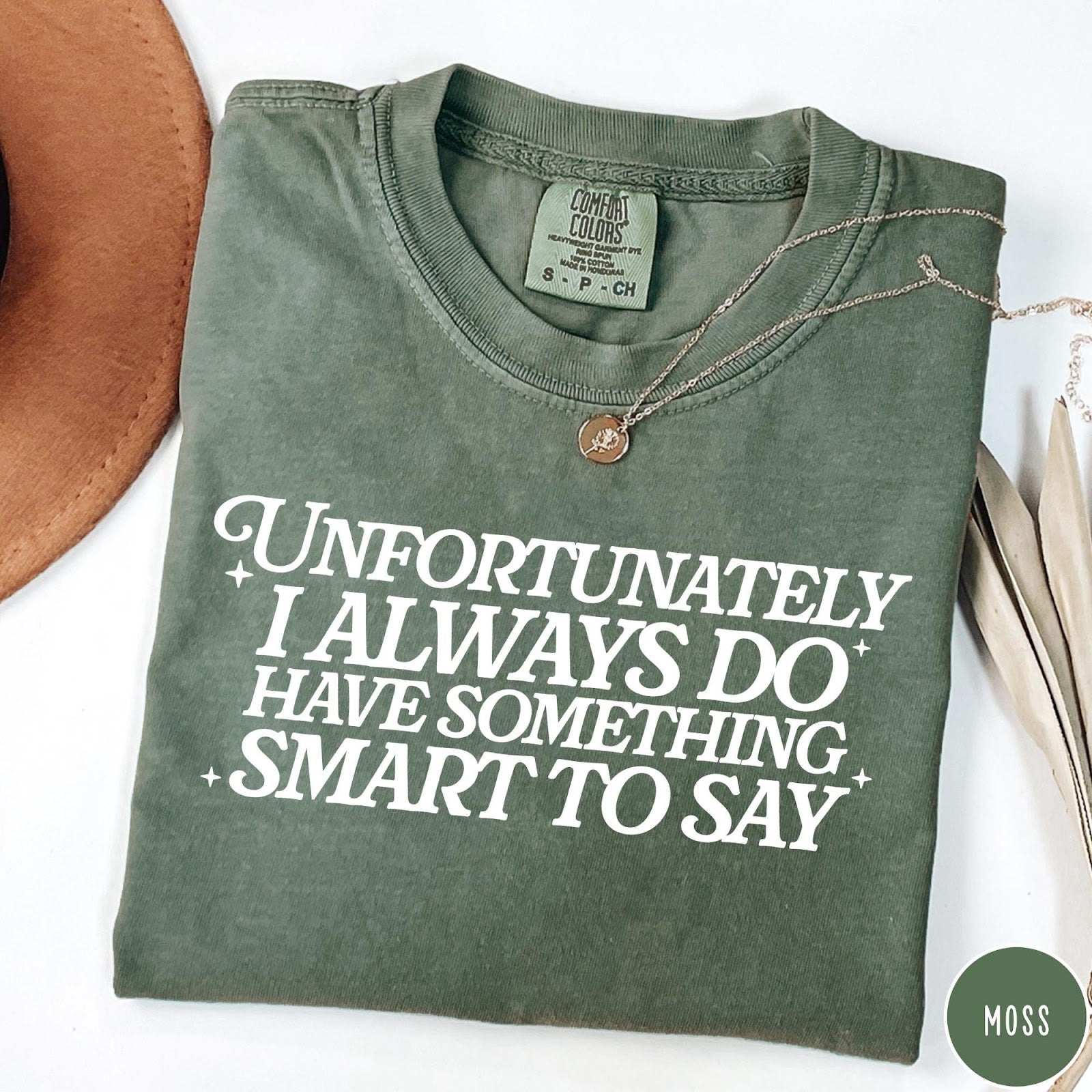 Comfort Colors tee in Moss featuring typography graphic with the text Unfortunately I Always Do Have Something Smart To Say