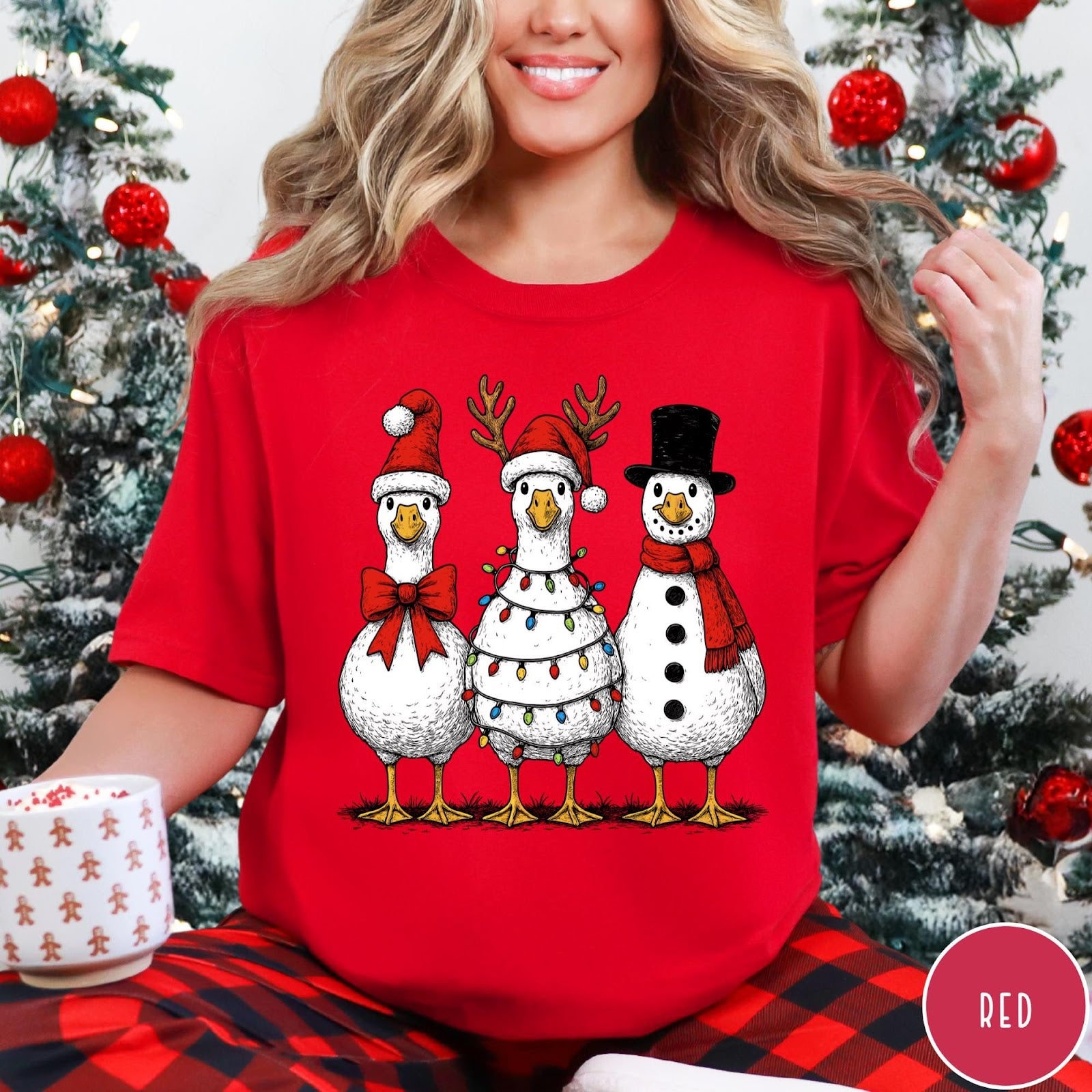 Comfort Colors tee in Red featuring festive holiday graphic of three geese dressed as Santa and snowman