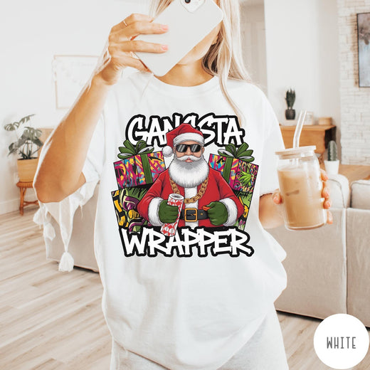 Comfort Colors tee in White featuring cartoon style Santa Claus wearing sunglasses and gold chain holding wrapping paper