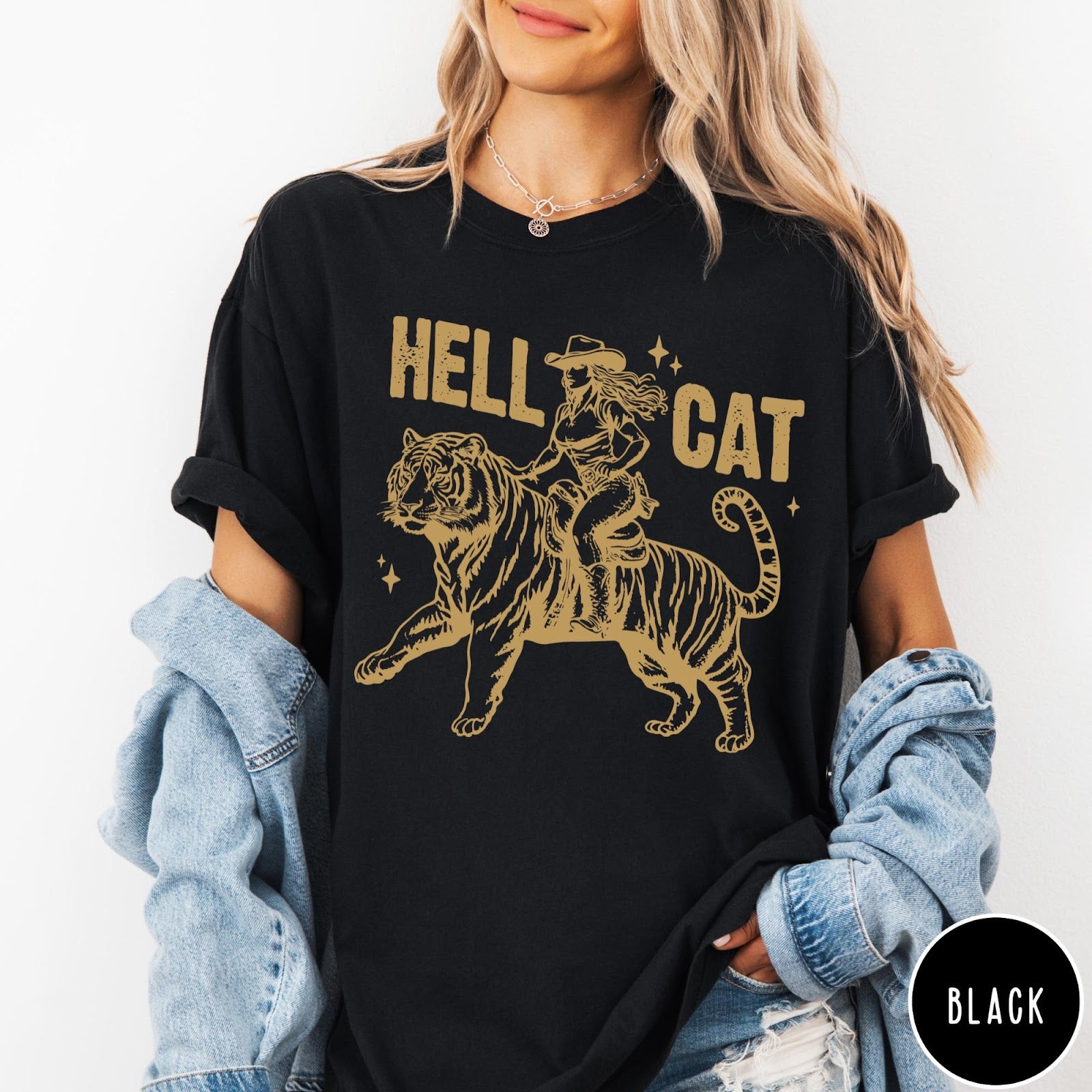 Comfort Colors tee in Black featuring western style graphic of a cowgirl riding a large tiger