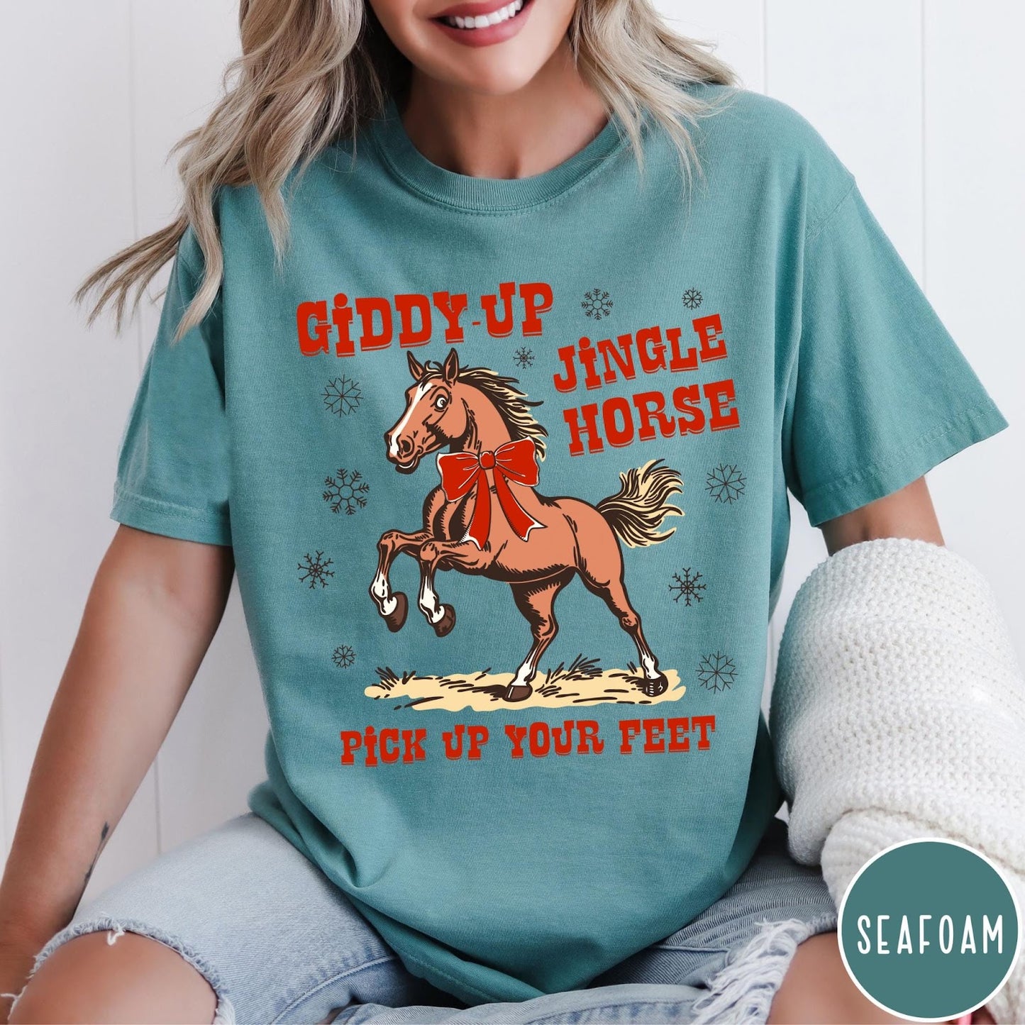 Comfort Colors tee in Seafoam featuring festive holiday graphic with a prancing horse wearing a red bow