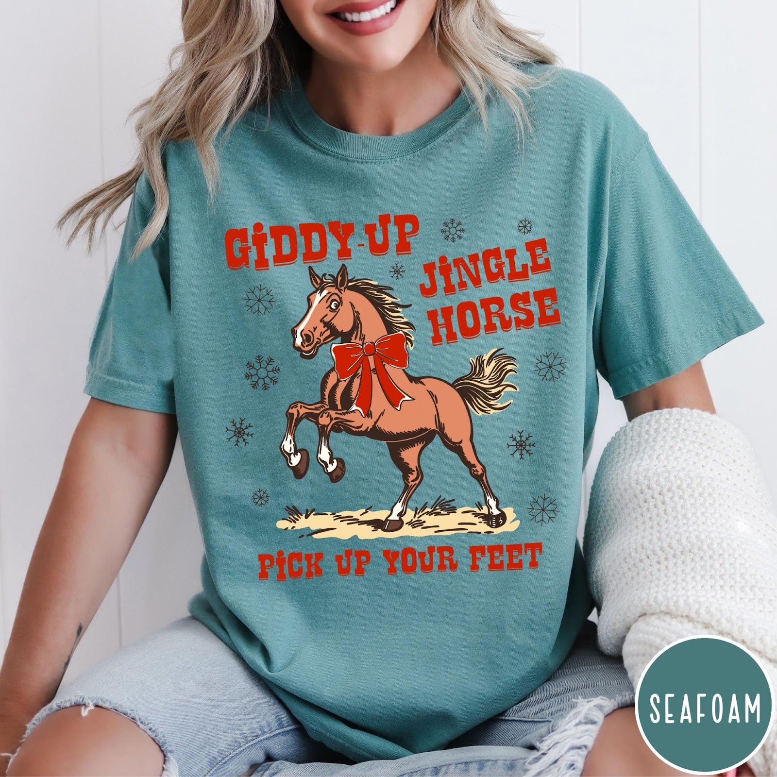 Comfort Colors tee in Seafoam featuring festive holiday graphic with a prancing horse wearing a red bow