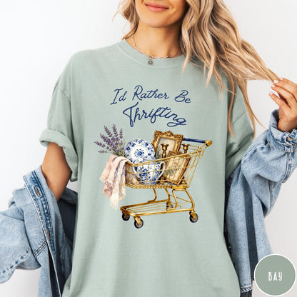 Comfort Colors tee in Bay featuring vintage decor graphic of a shopping cart filled with thrifted items