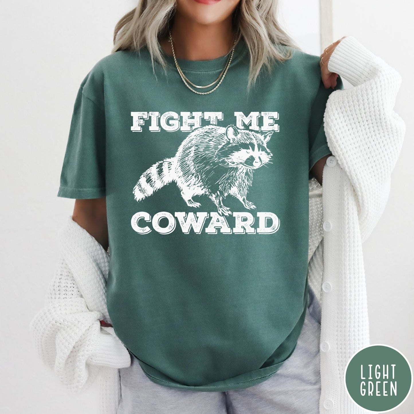 Comfort Colors tee in Light Green featuring screen printed raccoon graphic with Fight Me Coward text design