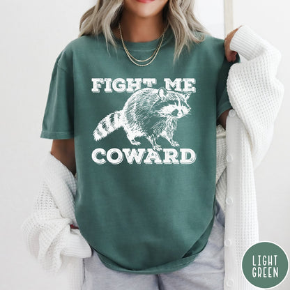 Comfort Colors tee in Light Green featuring screen printed raccoon graphic with Fight Me Coward text design
