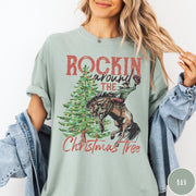Comfort Colors tee in Bay featuring western graphic design of a cowboy on a bucking horse Christmas tree