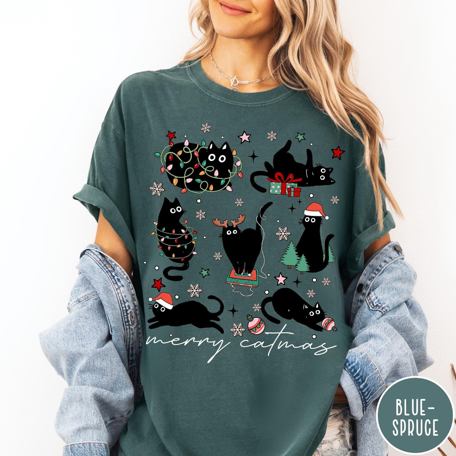 Comfort Colors tee in Blue Spruce featuring festive holiday graphic with multiple black cats and Christmas elements