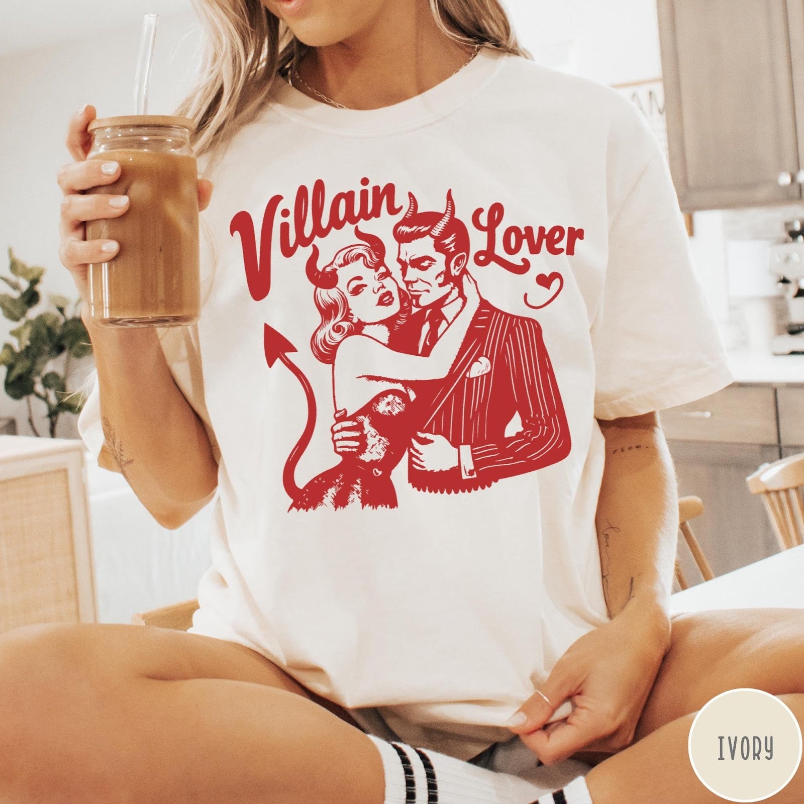 Comfort Colors tee in Ivory featuring vintage style graphic of a devilish couple embracing each other