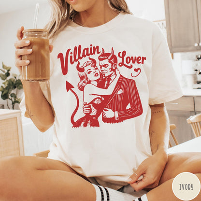 Comfort Colors tee in Ivory featuring vintage style graphic of a devilish couple embracing each other