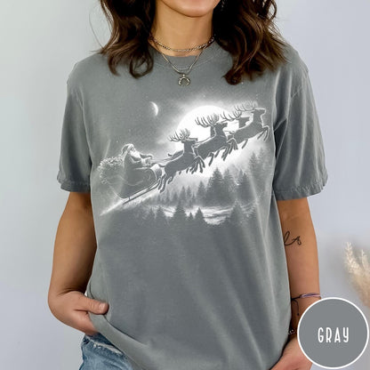 Comfort Colors tee in Gray featuring vintage style graphic of Santa Claus flying his sleigh with reindeer