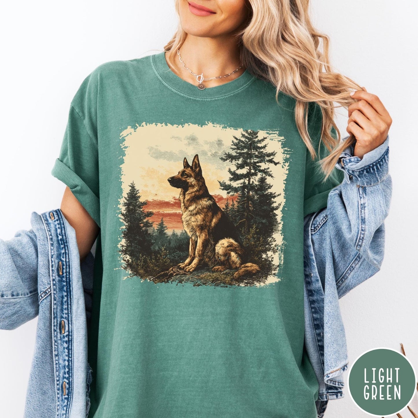 Comfort Colors tee in Light Green featuring vintage style graphic of a German Shepherd sitting in a forest