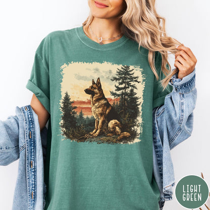 Comfort Colors tee in Light Green featuring vintage style graphic of a German Shepherd sitting in a forest