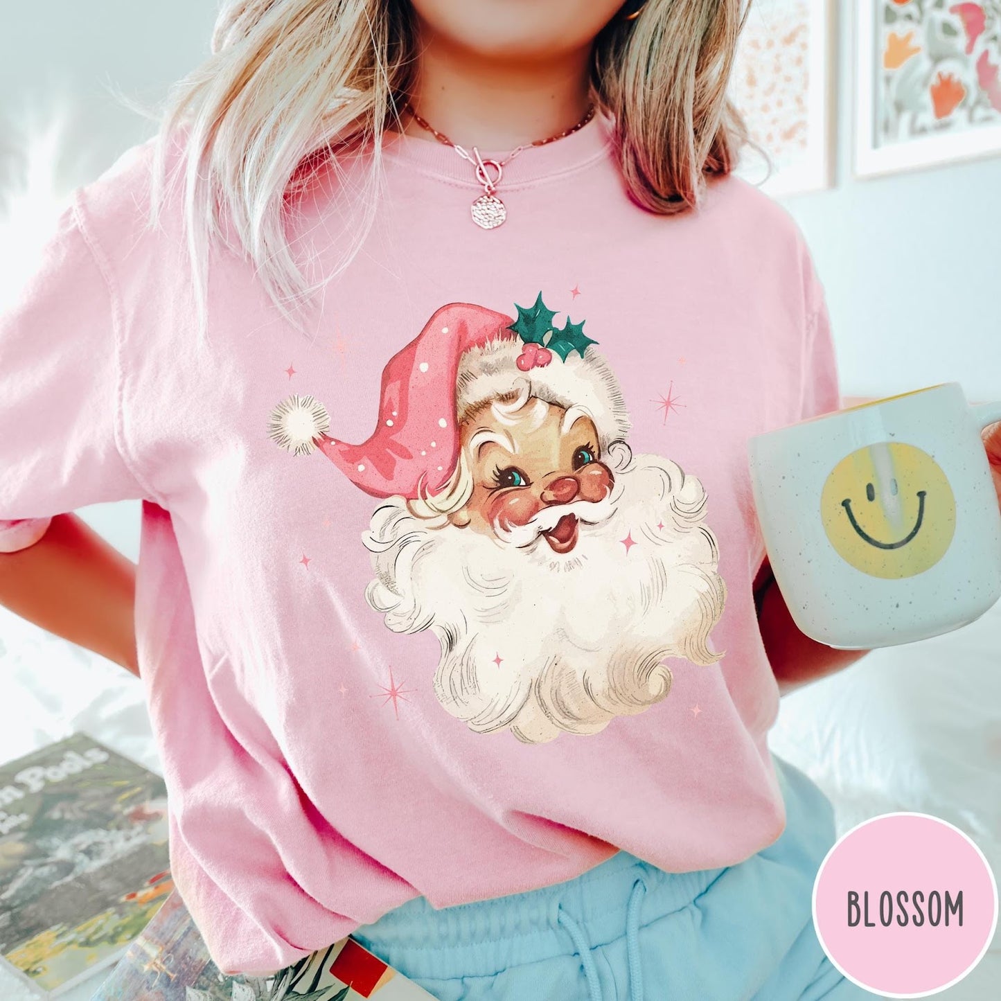 Comfort Colors tee in Blossom featuring retro Christmas style graphic of a smiling Santa Claus with pink hat