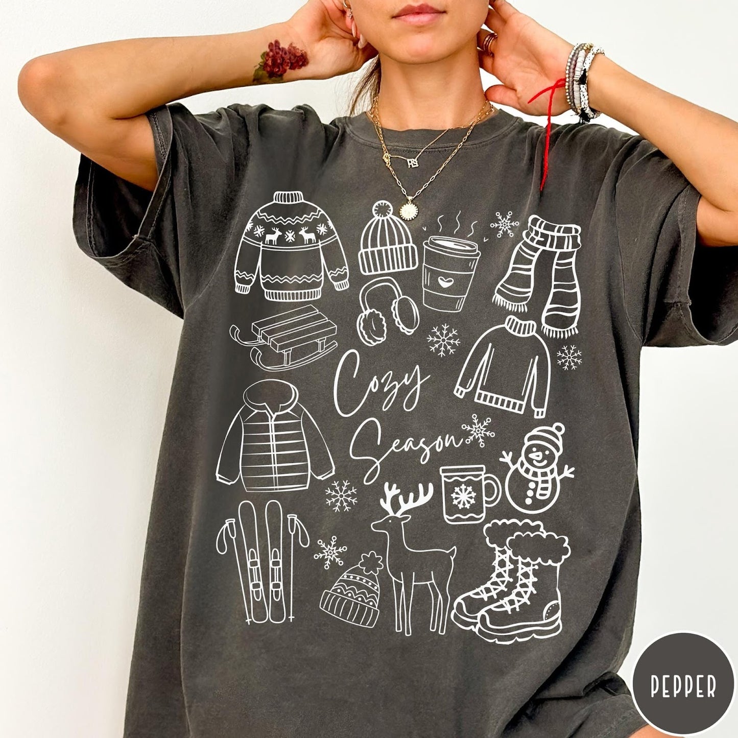 Comfort Colors tee in Pepper featuring line art winter activities and seasonal items graphic design
