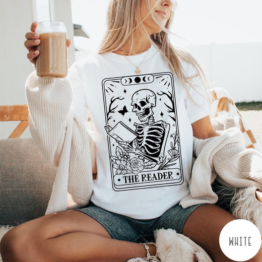 Comfort Colors tee in White featuring tarot card style graphic of a skeleton reading a book