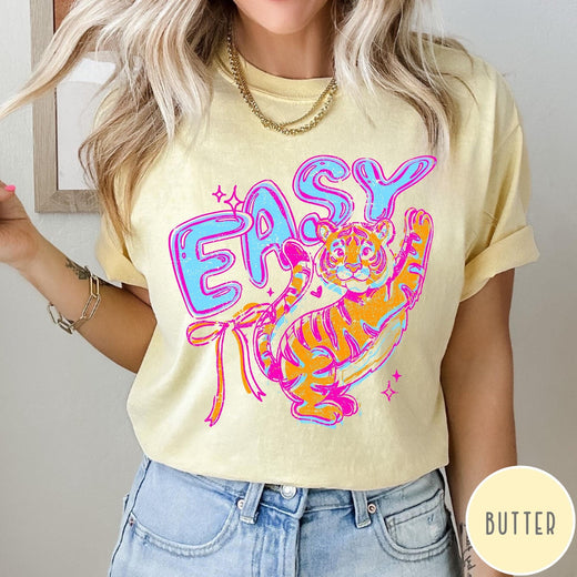 Comfort Colors tee in Butter featuring retro style graphic of a tiger with blue and orange colors
