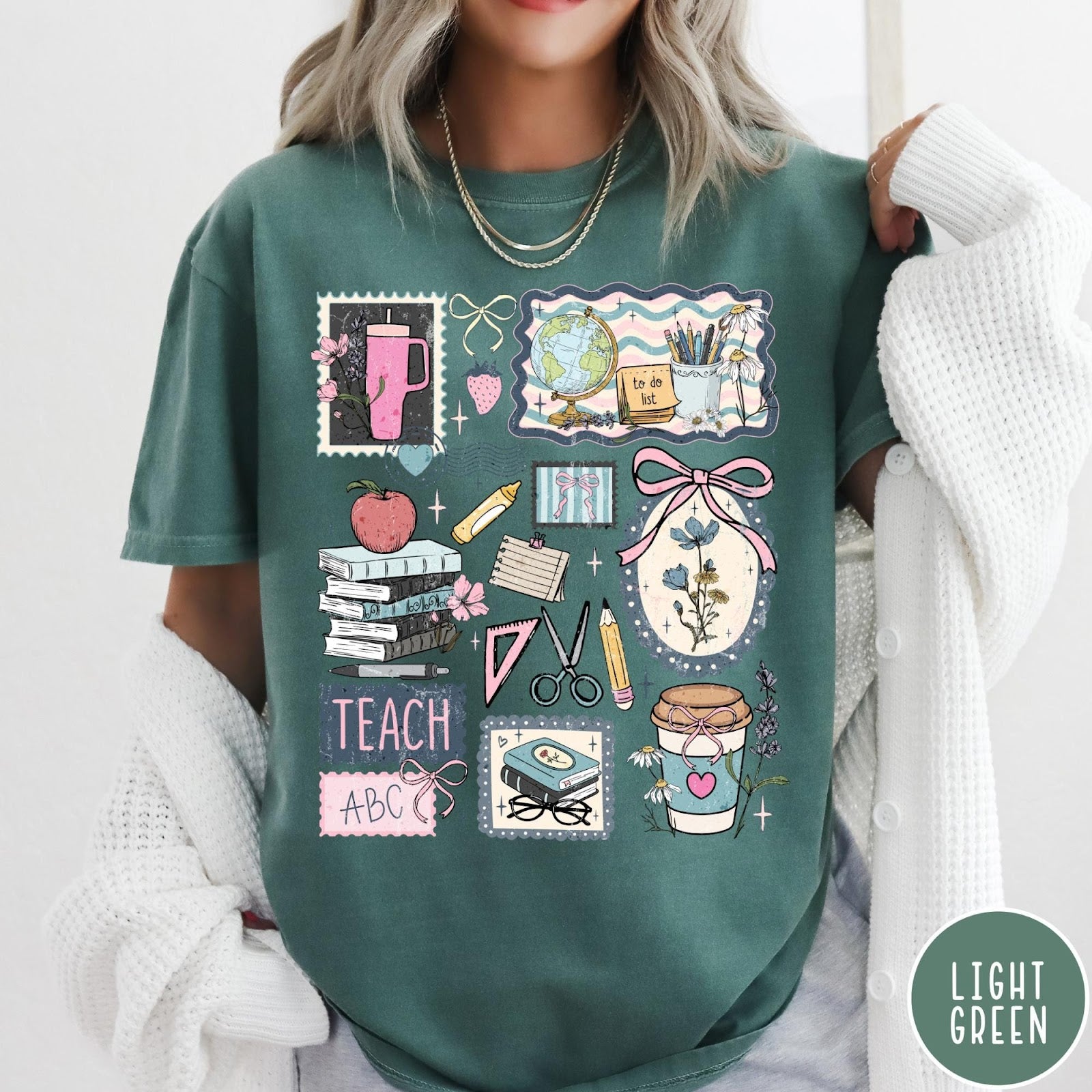 Comfort Colors tee in Light Green featuring collage style graphic with school supplies, books, and teacher life elements