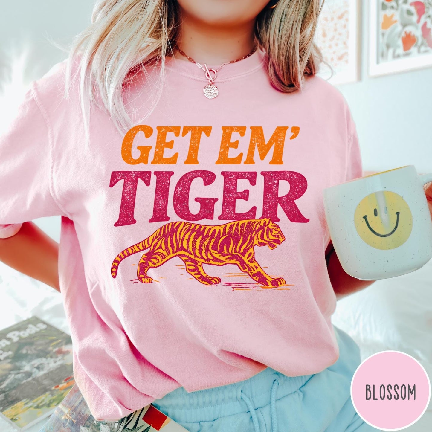 Comfort Colors tee in Blossom featuring vintage style graphic with Get Em Tiger text and tiger illustration