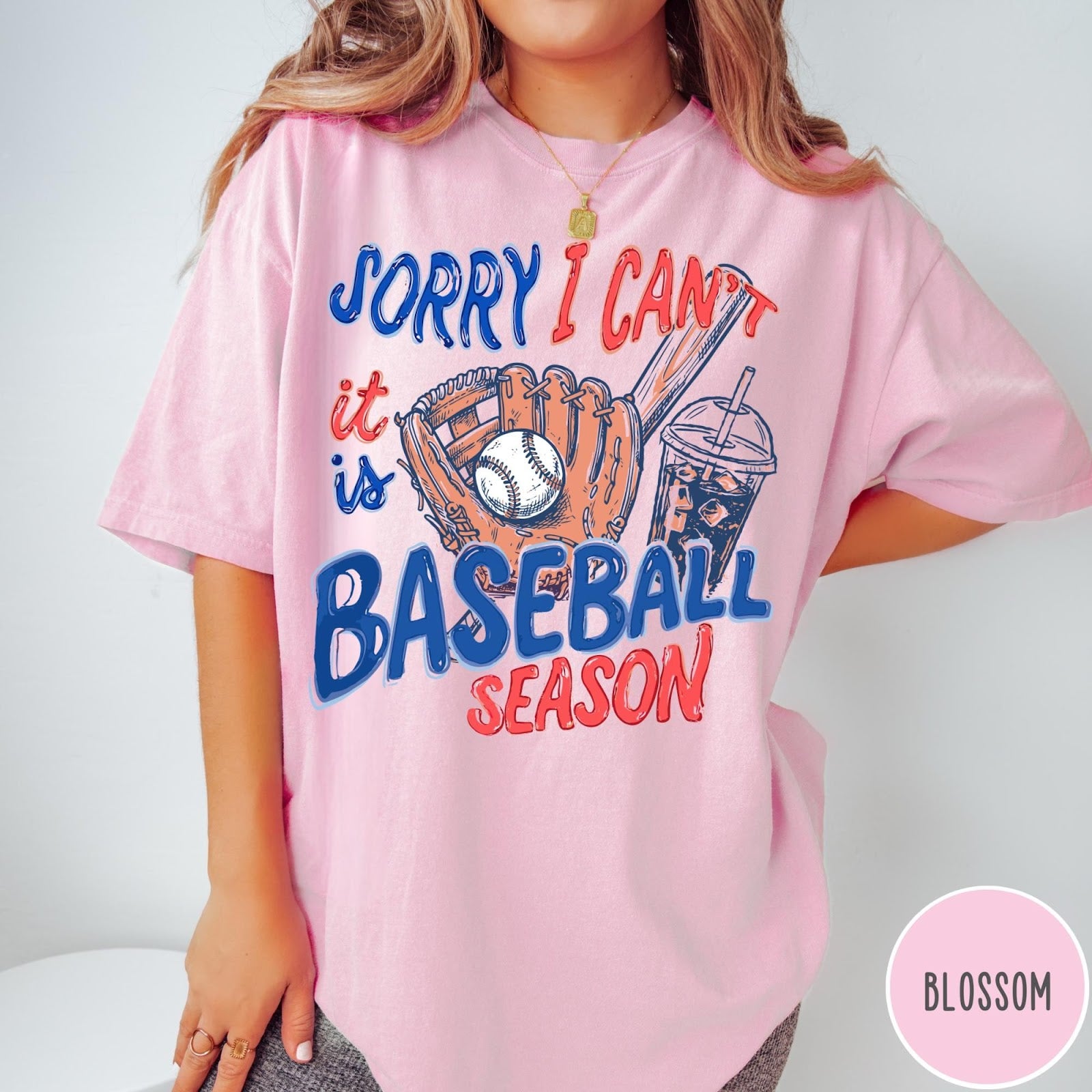 Comfort Colors tee in Blossom featuring baseball graphic with glove, ball, bat, and iced coffee