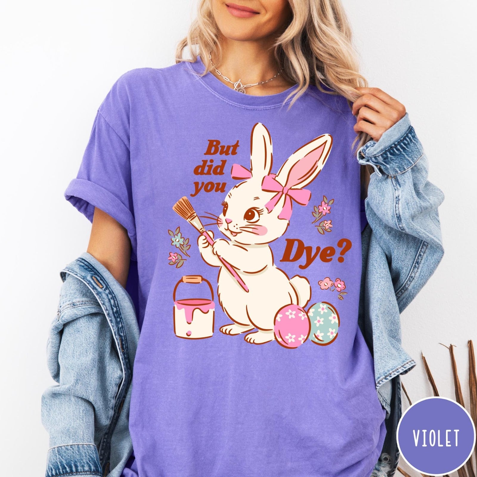 Comfort Colors tee in Violet featuring Easter bunny design with paintbrush, paint bucket, and decorated Easter eggs