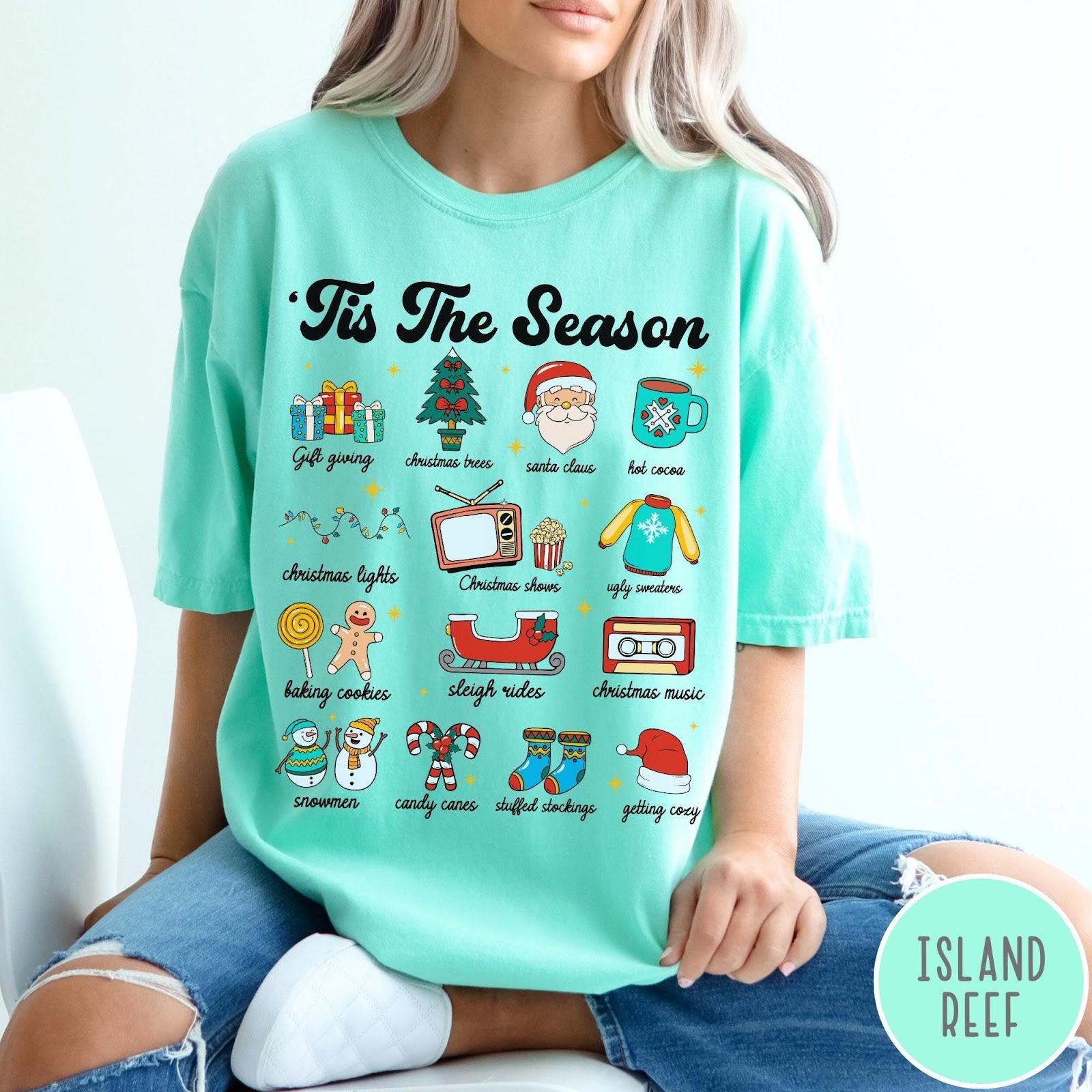 Comfort Colors tee in Island Reef featuring holiday icons graphic with Christmas trees, Santa, and festive seasonal imagery