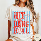 Comfort Colors tee in Ivory featuring baseball design with red text and a blue striped background graphic