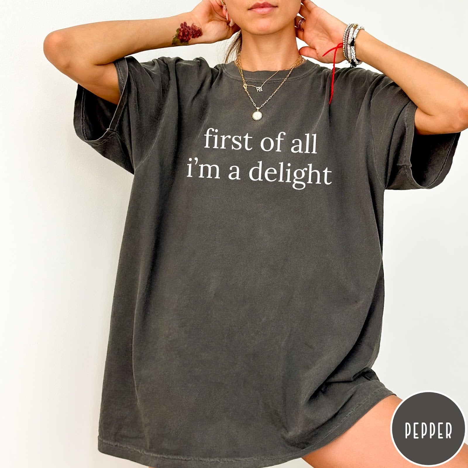Comfort Colors tee in Pepper featuring typography graphic reading first of all i'm a delight in white