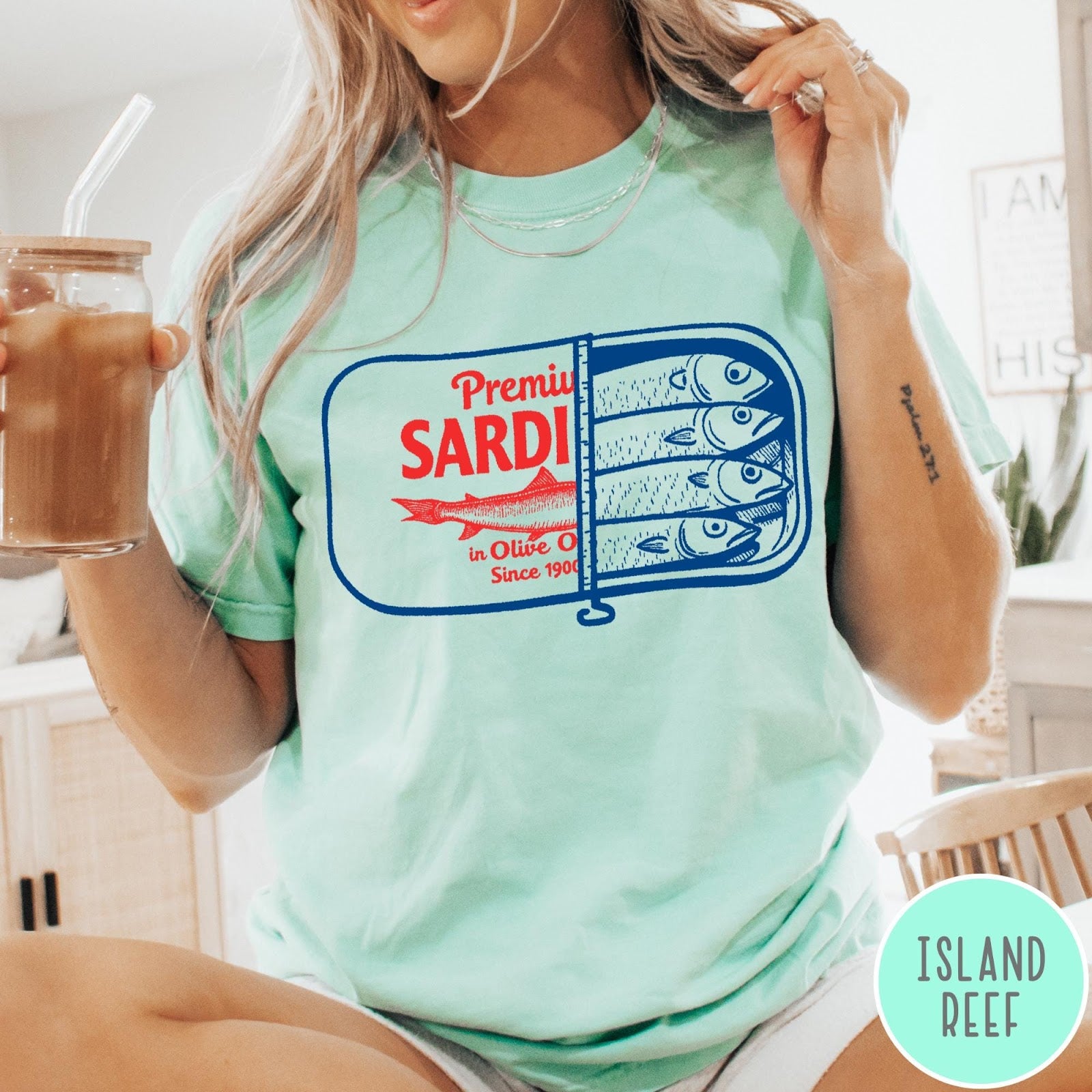 Comfort Colors tee in Island Reef featuring vintage style sardine tin graphic with red text and blue fish