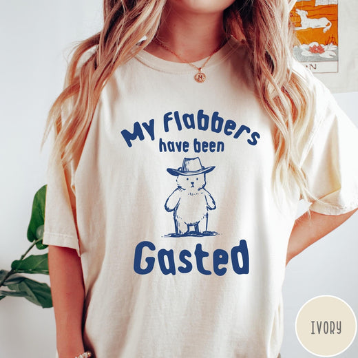 Comfort Colors tee in Ivory featuring illustrated style bear wearing a cowboy hat and text graphic