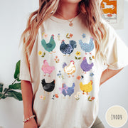 Comfort Colors tee in Ivory featuring vintage style graphic with various colorful chickens and small floral accents