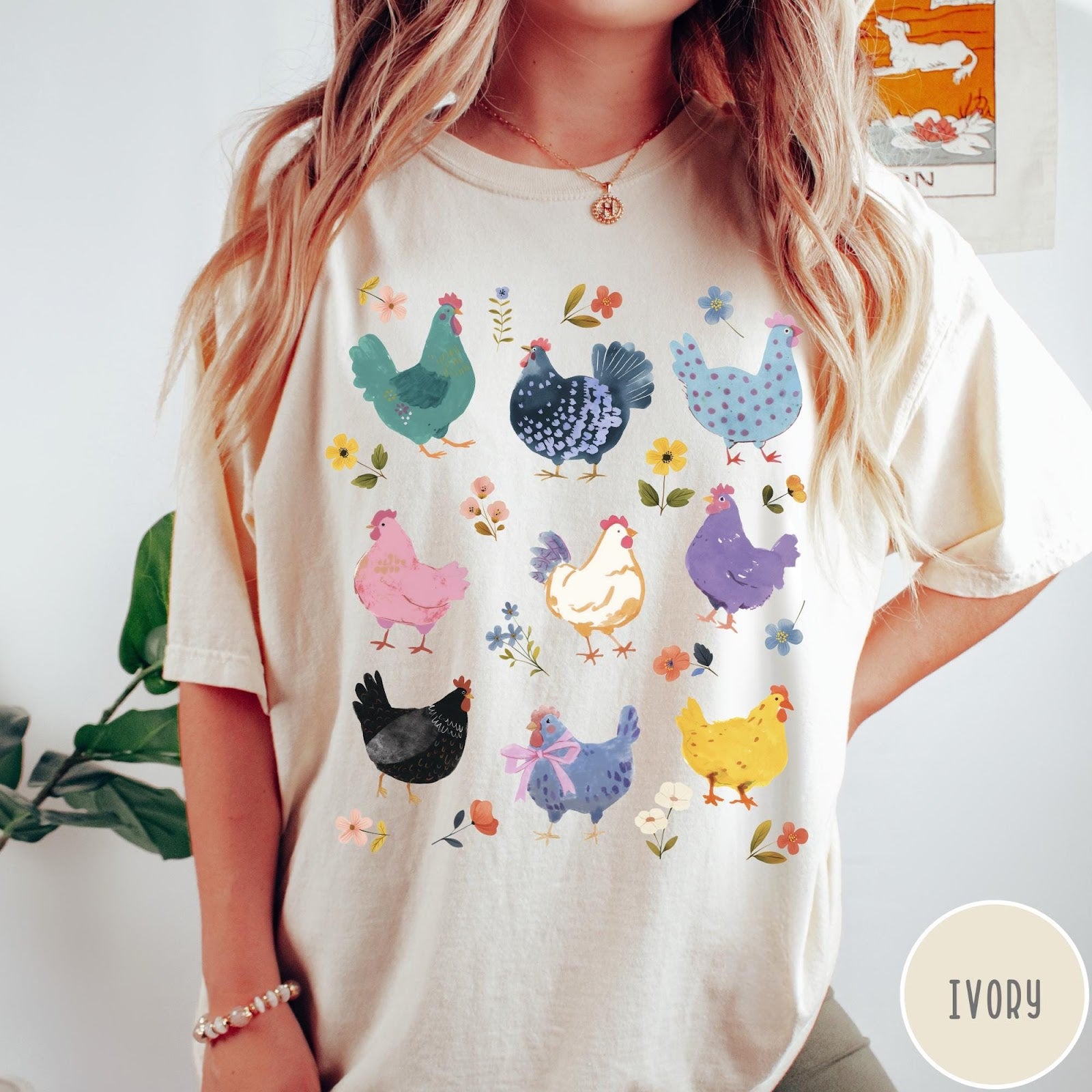 Comfort Colors tee in Ivory featuring vintage style graphic with various colorful chickens and small floral accents