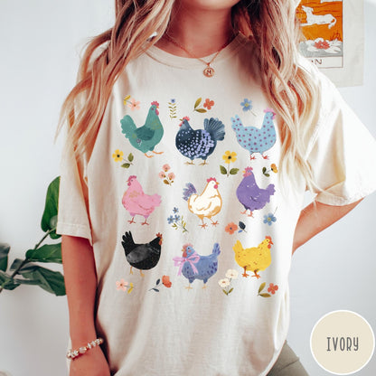 Comfort Colors tee in Ivory featuring vintage style graphic with various colorful chickens and small floral accents
