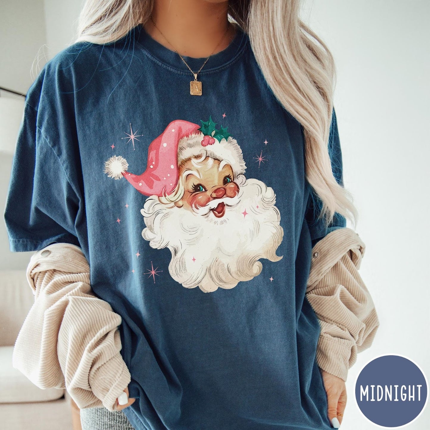 Comfort Colors tee in Midnight featuring retro Christmas style graphic of a smiling Santa Claus with pink hat