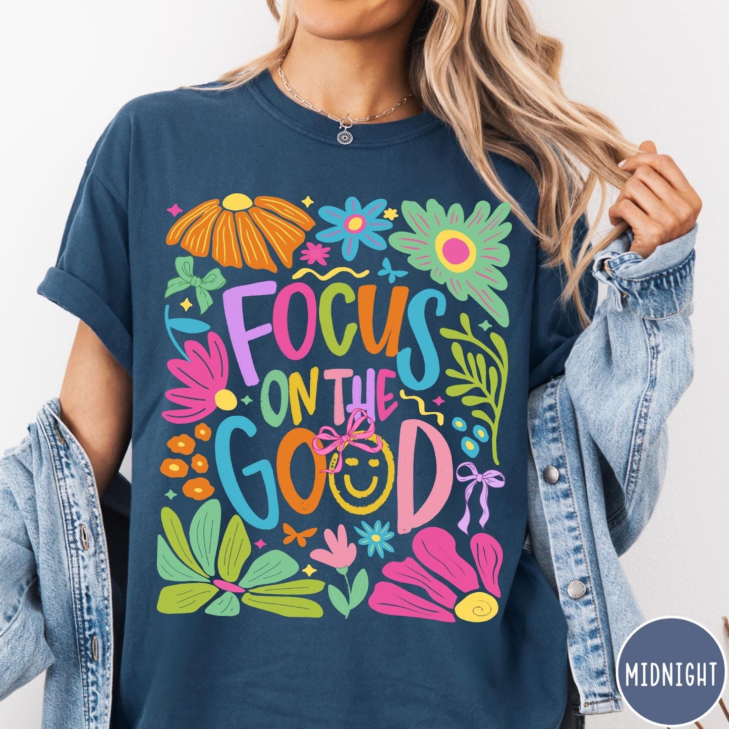 Comfort Colors tee in Midnight featuring positivity typography and floral collage graphic with a smiley face.