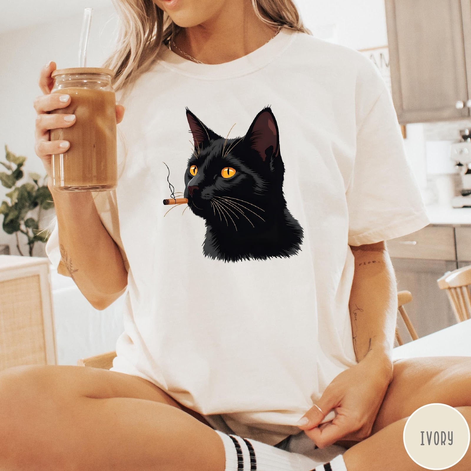 Comfort Colors tee in Ivory featuring graphic illustration of a black cat smoking a cigarette.