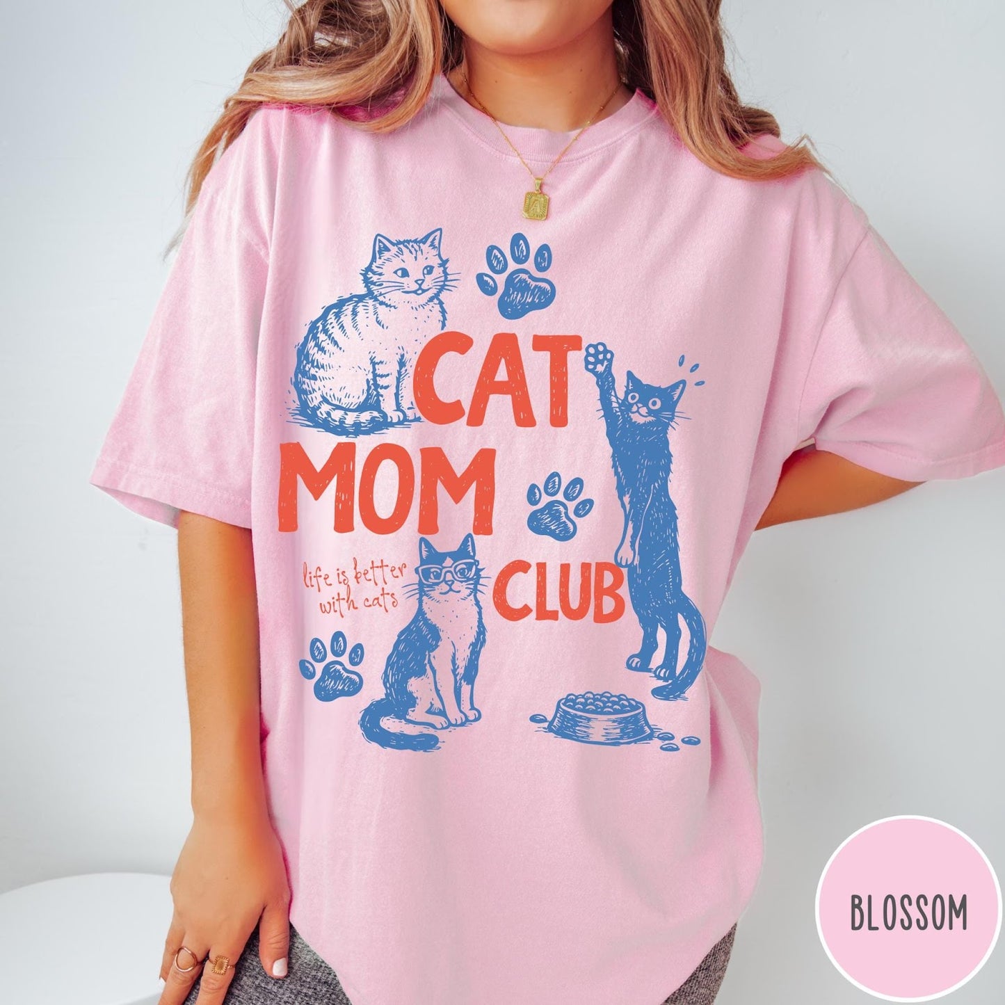 Comfort Colors tee in Blossom featuring graphic design with cats, paw prints, and Cat Mom Club text