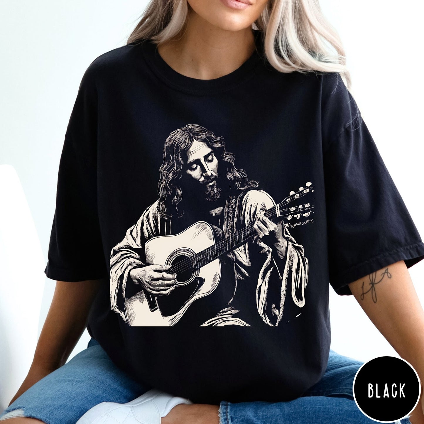 Comfort Colors tee in Black featuring vintage style graphic of Jesus playing an acoustic guitar