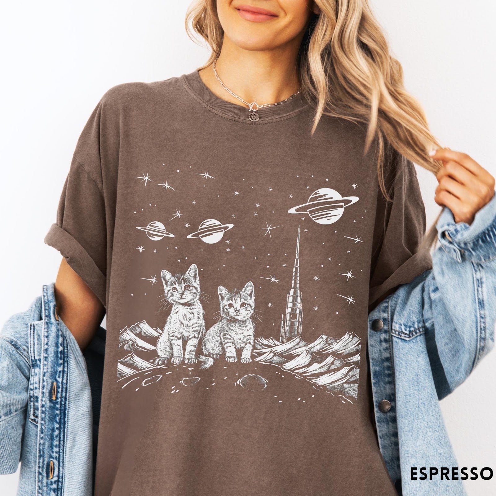 Comfort Colors tee in Espresso featuring line art graphic of two kittens sitting on a planet with rocket