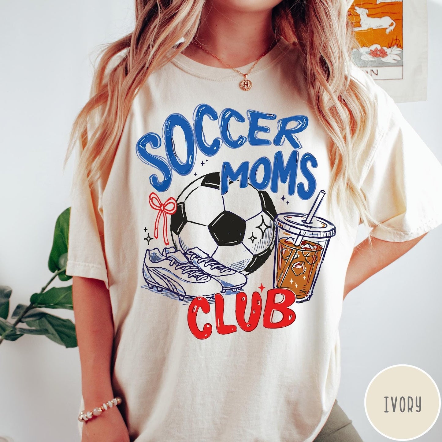 Comfort Colors tee in Ivory featuring soccer mom lifestyle graphic with soccer ball, cleats, and iced coffee
