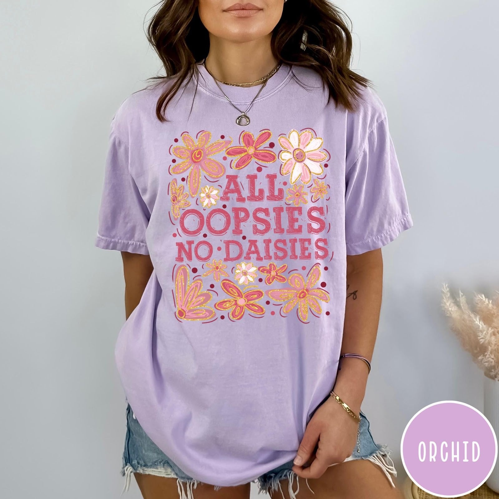 Comfort Colors tee in Orchid featuring floral design with funny quote All Oopsies No Daisies text graphic