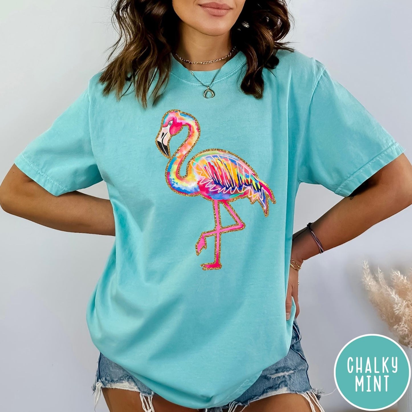 Comfort Colors tee in Chalky Mint featuring artistic watercolor flamingo graphic with gold glitter outline details