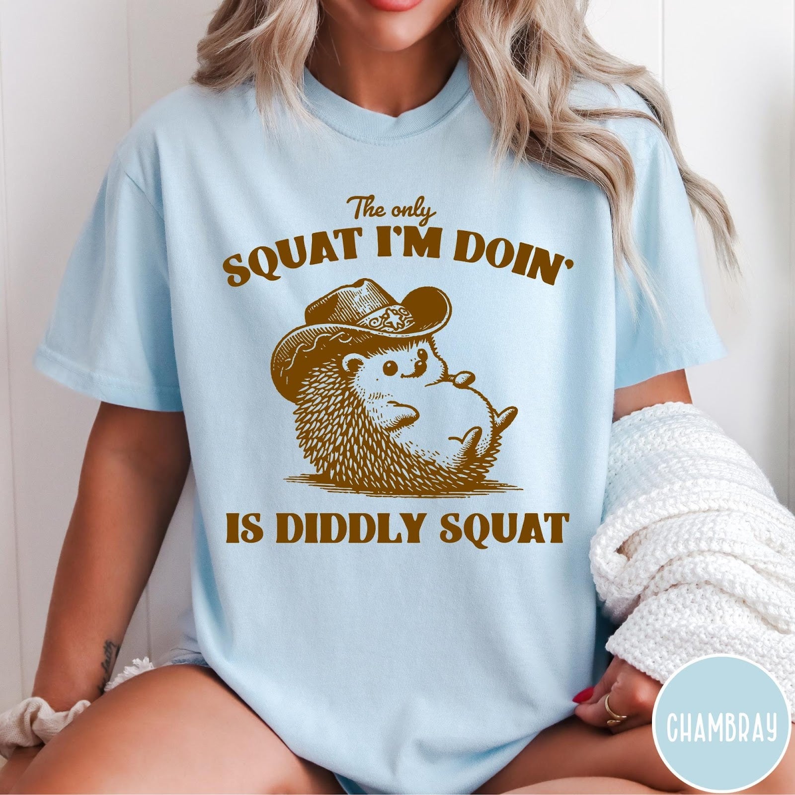 Comfort Colors tee in Chambray featuring cute graphic style illustration of a hedgehog wearing a cowboy hat