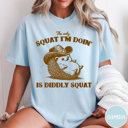 Comfort Colors tee in Chambray featuring cute graphic style illustration of a hedgehog wearing a cowboy hat