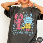 Comfort Colors tee in Pepper featuring lobster boil graphic with a lobster, cooking pot, and lemon slices.