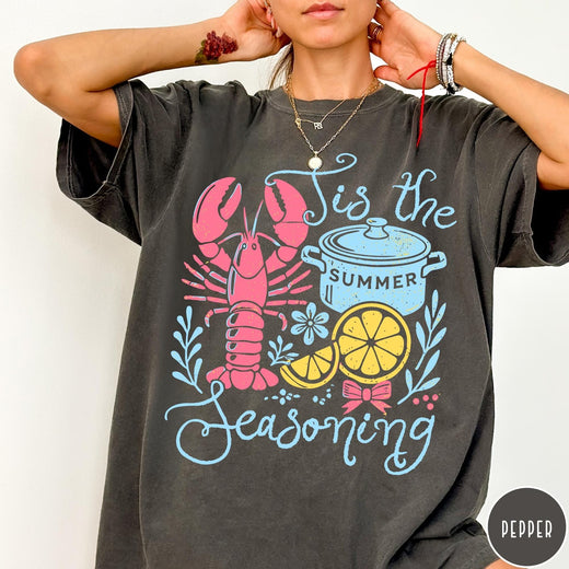 Comfort Colors tee in Pepper featuring lobster boil graphic with a lobster, cooking pot, and lemon slices.